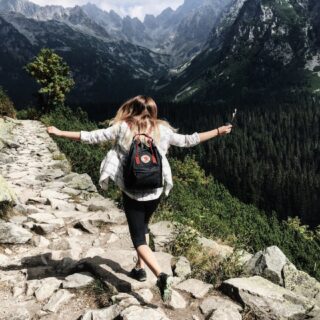 Woman jumping on a mountain